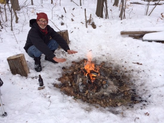 Woodsman (alias husband or forest troll) warming up at campfire on top of Seven Fields.