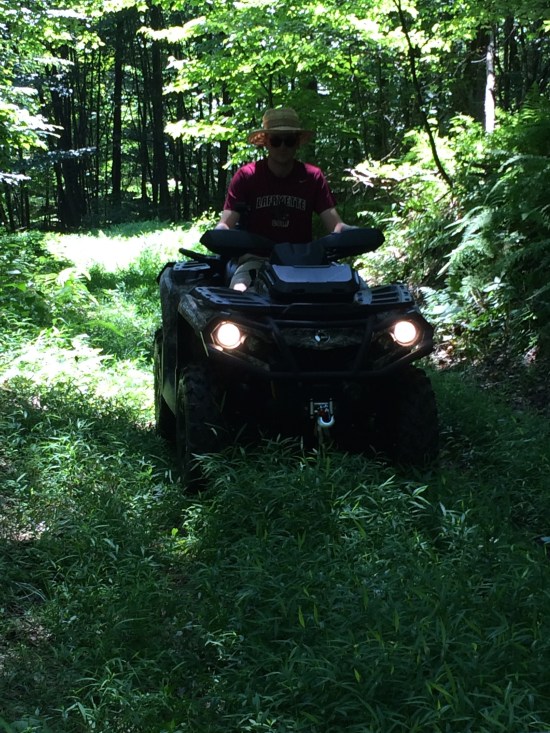 Younger son on ATV.
