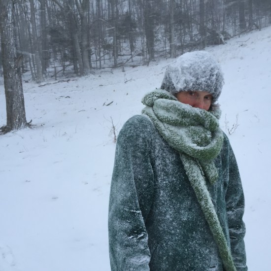 Author poses for husband in blizzard.